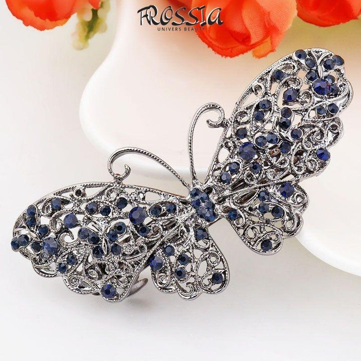 barrette avec papillon turquoise dans cheveux. | Frossia